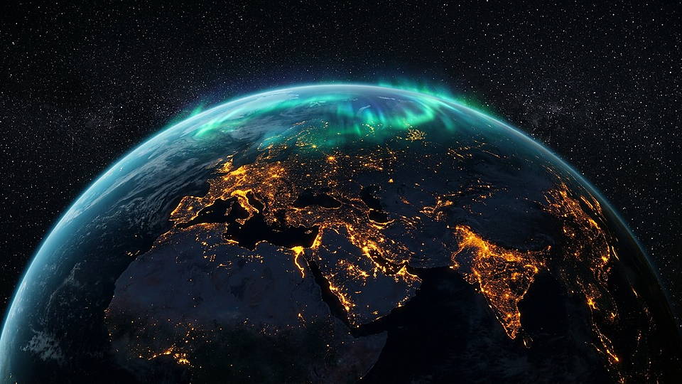 Illustration photoréaliste en lien avec la fiche « La densité moyenne de la Terre. » : Face nocturne de la Terre, lumières urbaines et limbe atmosphérique.